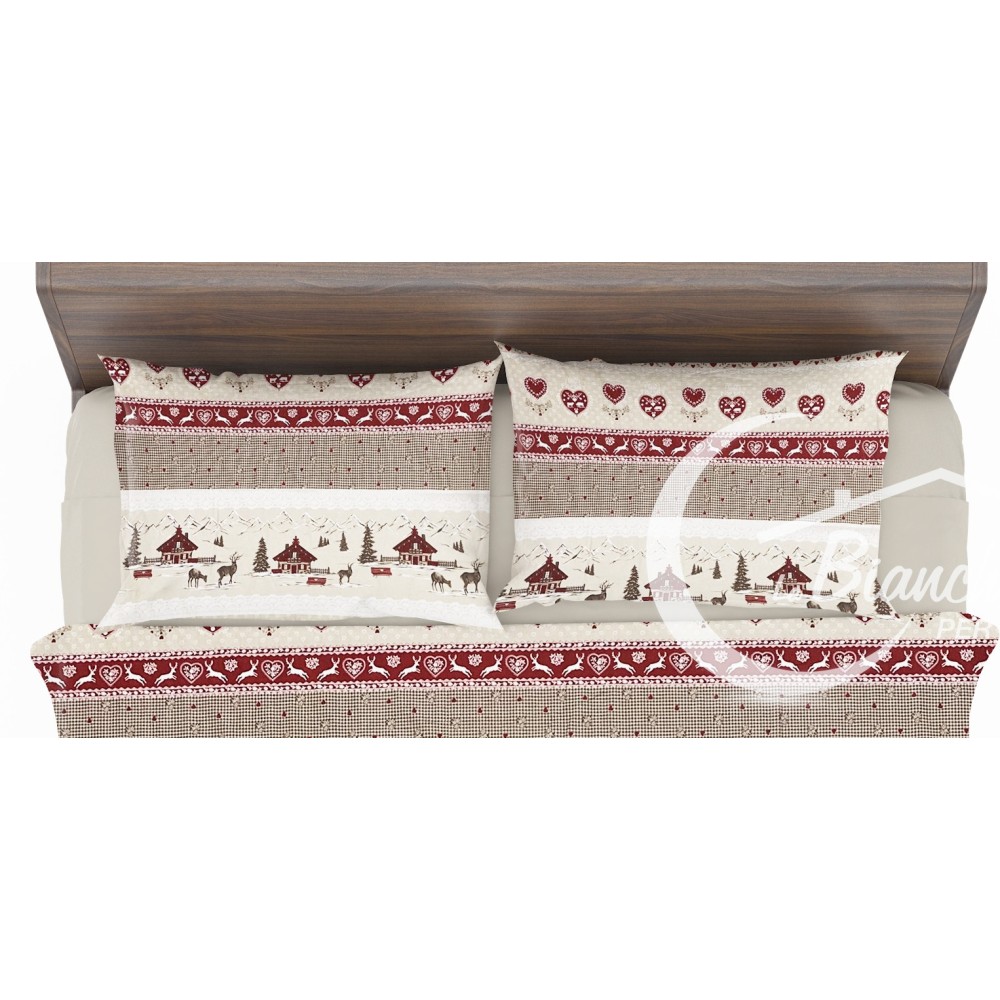 Les draps d’hiver de Valbadia posés sur le lit double, ambiance chaleureuse et accueillante