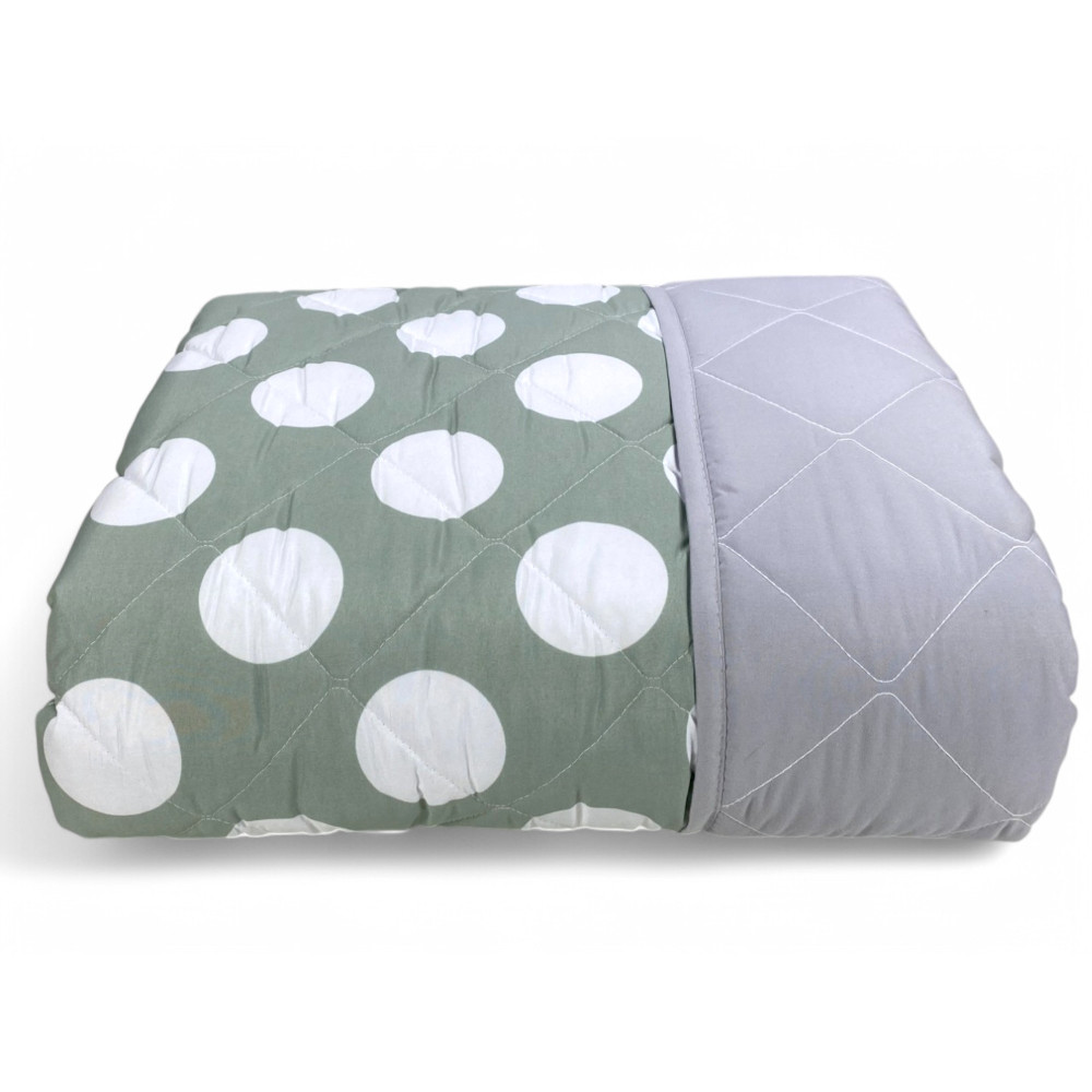 Détail en tissu de couvre-lit matelassé - motif à pois avec coutures en losange