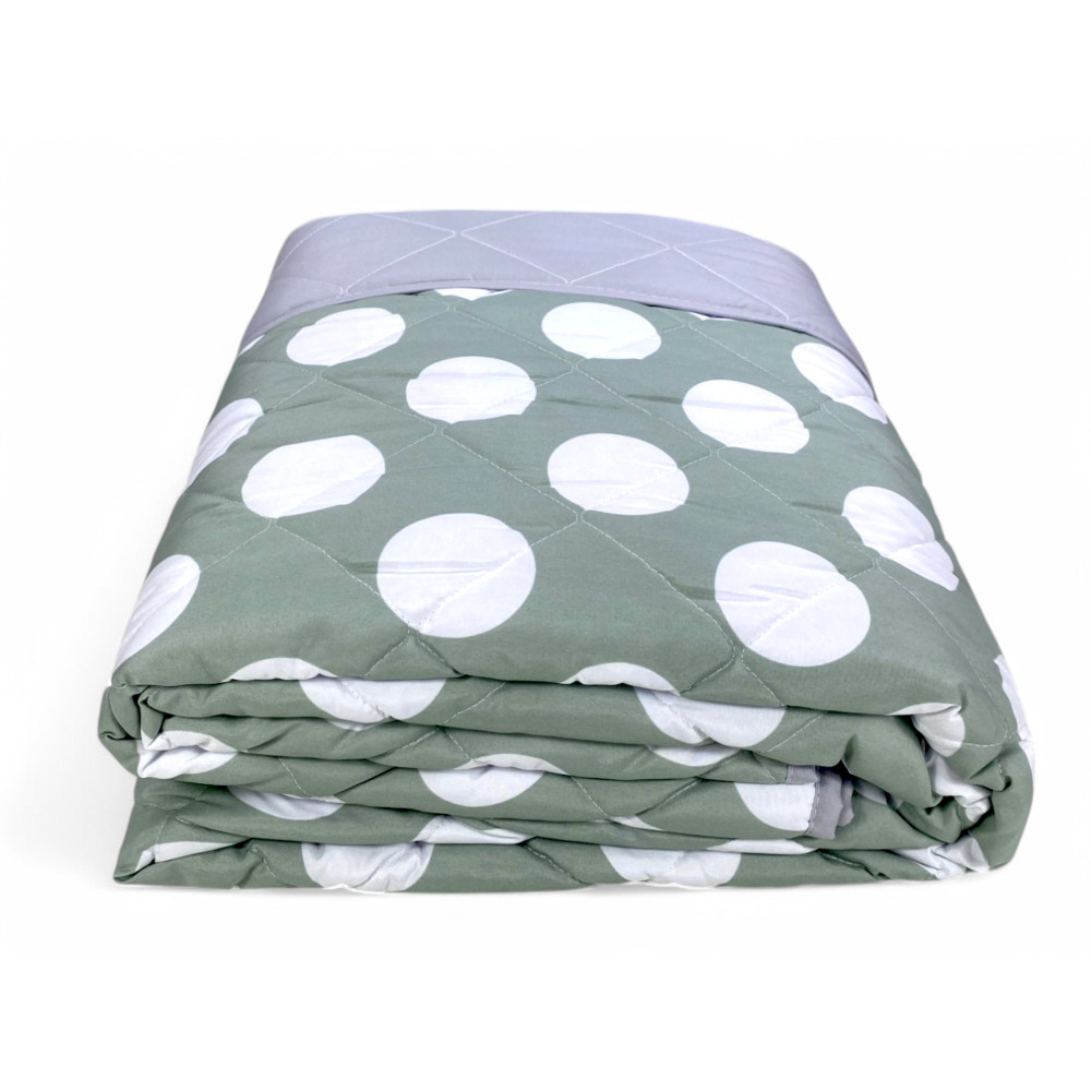 Solid light grey bedspread back, matching the polka dot design