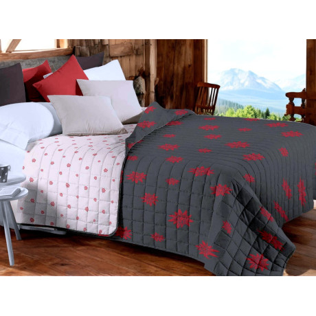 Copriletto trapuntato Edelweiss grigio con decoro rosso su letto rustico