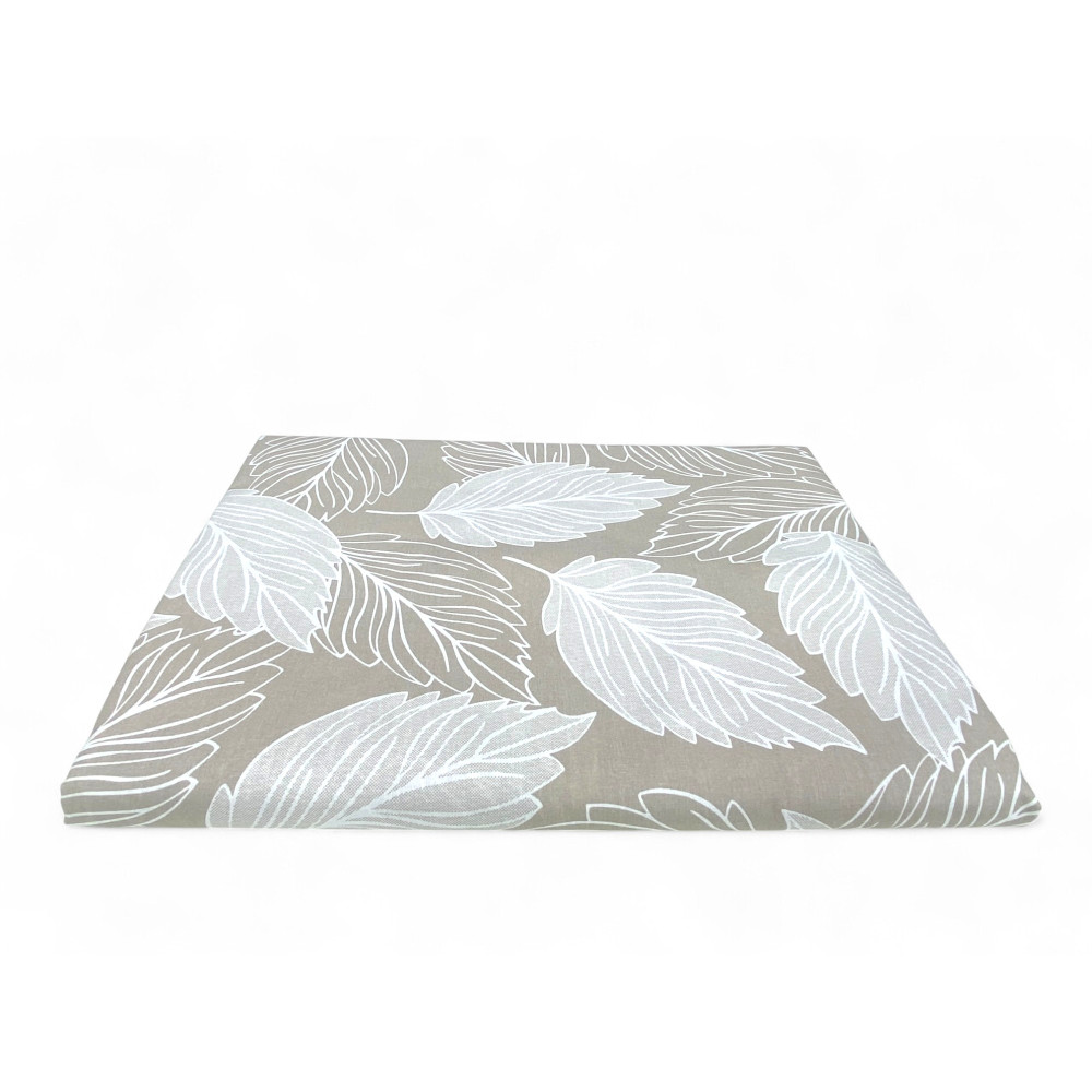 Dettaglio tessuto cotone beige con motivo foglie del telo arredo copritutto
