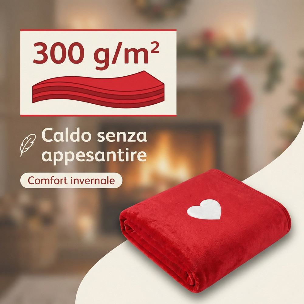 Manta de invierno de 300 g por metro cuadrado, roja con corazón blanco doblada sobre la mesa de centro